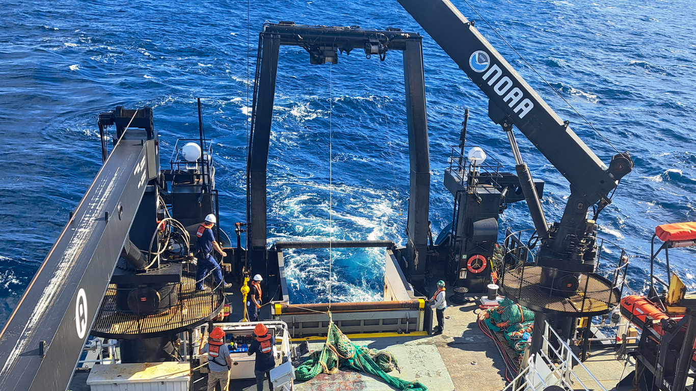 NOAA vessel conducting a bottom trawl survey in the day