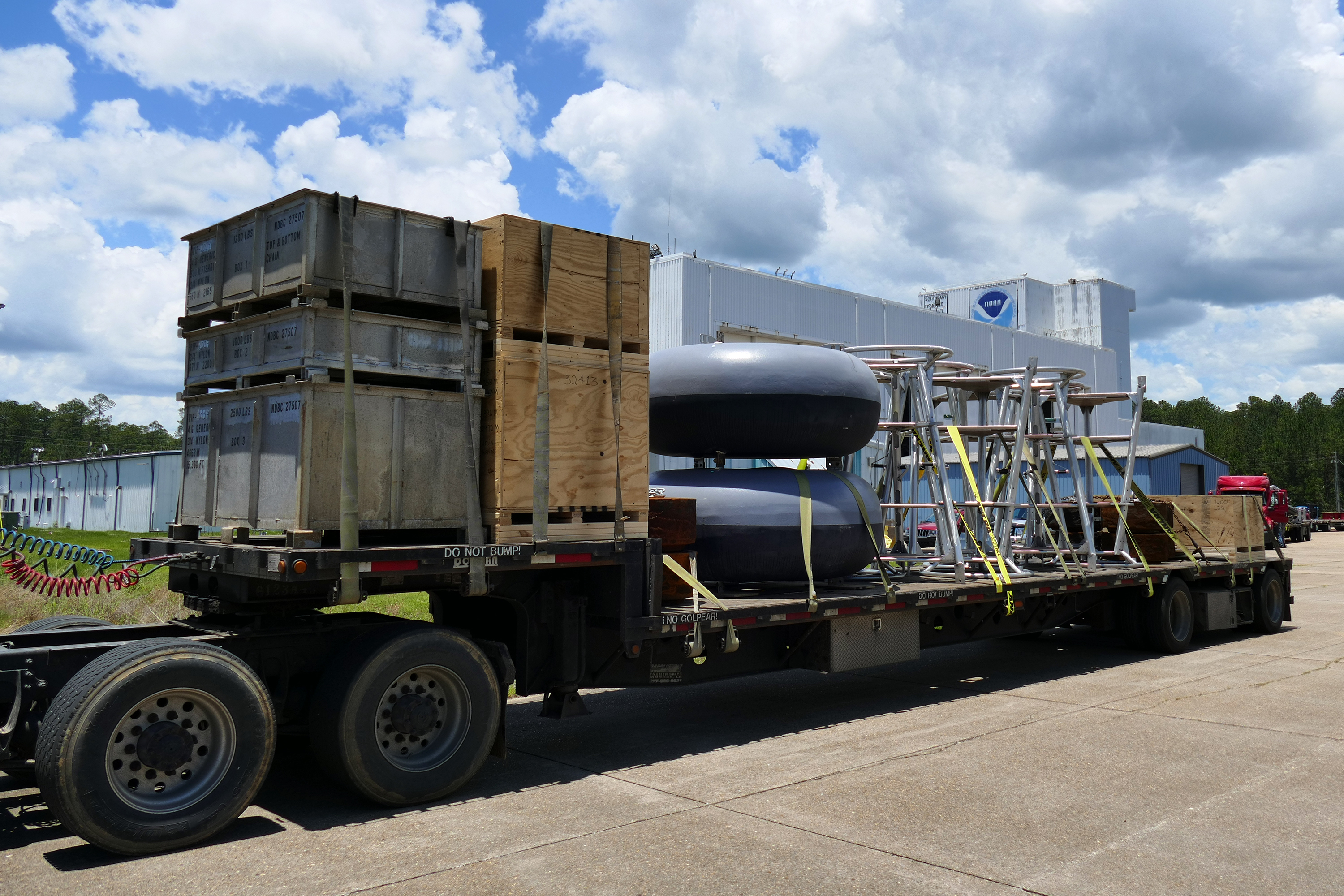 In late February, workers at the National Data Buoy Center located at the Stennis Space Center along the Mississippi Gulf Coast loaded up a half dozen flatbed trucks with parts to repair and deploy new buoys for the mission. You can get a real sense of the size of these buoys when seen on the truck, which are 7 feet in diameter and 16 feet tall. The annual buoy maintenance mission runs eight months and has 10 port stops this year. 