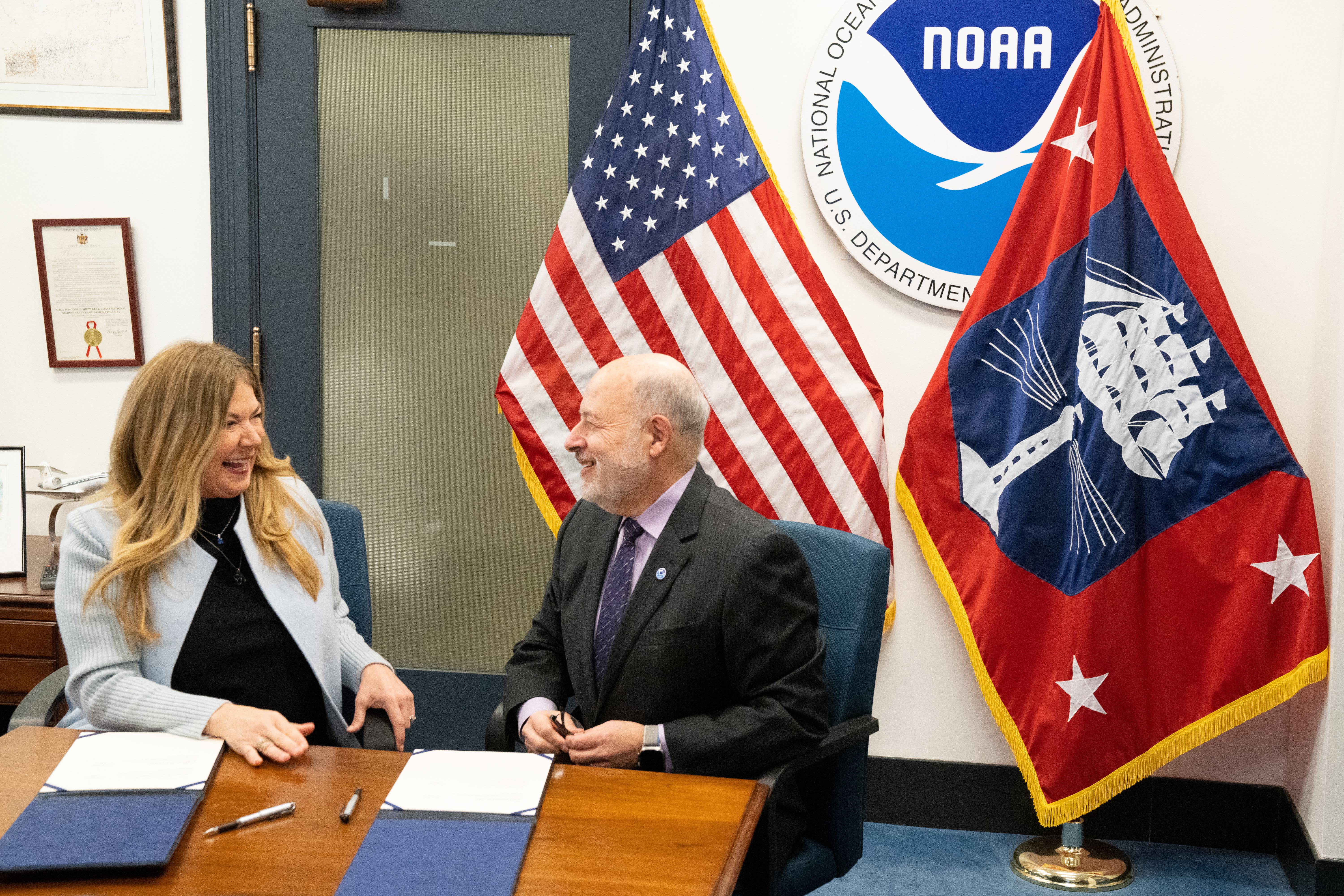\Kathi Vidal, Under Secretary of Commerce for Intellectual Property and Director of the United States Patent and Trademark Office (USPTO) and Richard W. Spinrad, Ph.D., Under Secretary of Commerce for Oceans and Atmosphere and NOAA Administrator sign a memorandum of understanding (MOU) between the USPTO and NOAA at the Department of Commerce's Herbert C. Hoover Building on January 24, 2024, in Washington, DC.