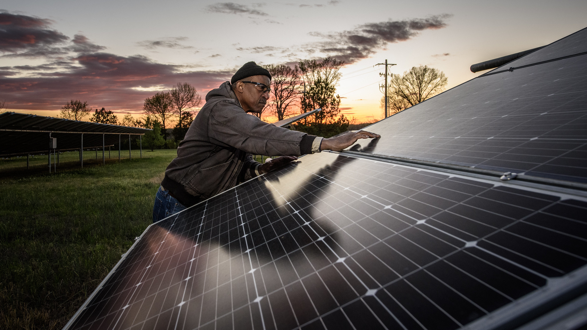 Photo of Aaron Webb who owns and operates a solar farm in Humboldt, Tennessee, funded in part by the USDA Rural Energy for America Program, which provides funding for renewable energy systems to make energy efficiency improvements. With over 500kW of solar panels, the farm pictured here on April 4, 2024 has made a significant impact on the community, reducing the need for fossil fuels and providing clean power to the grid. Credit: USDA media by Lance Cheung.