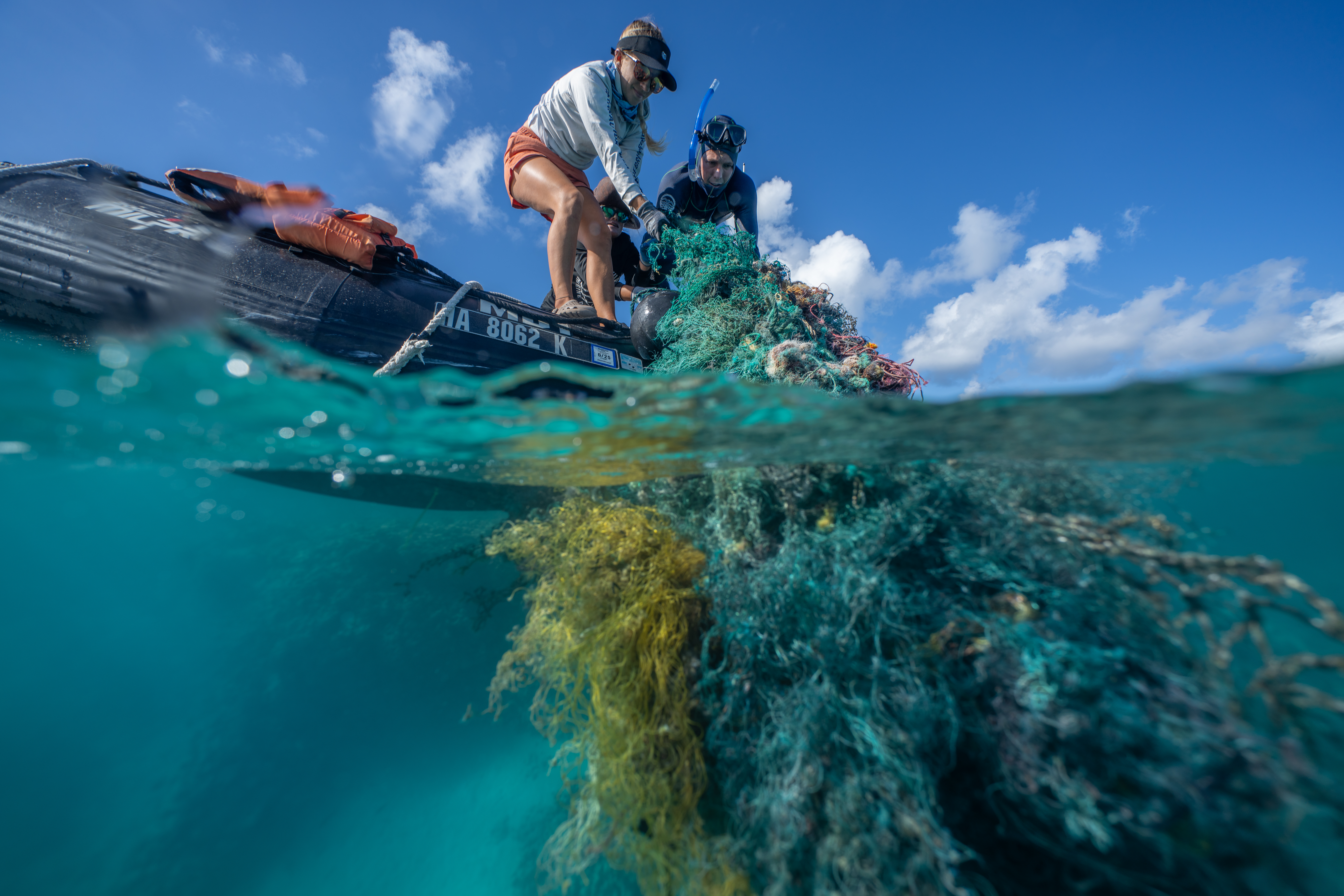 The Papahānaumokuākea Marine Debris Project team removes debris from Kamokuokamohoaliʻi, 2024.
