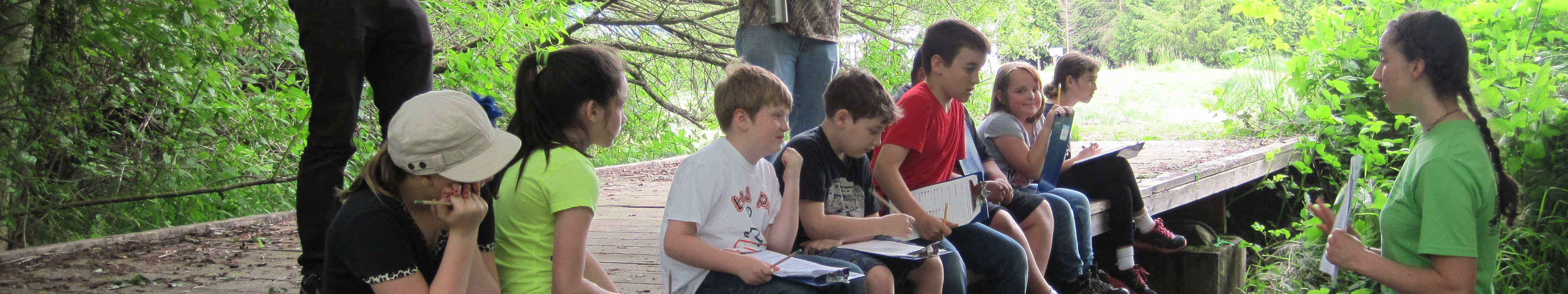 Students formulating their hypothesis during a stream exploration field trip with Nooksack Salmon Enhancement Association's Students for Salmon project.