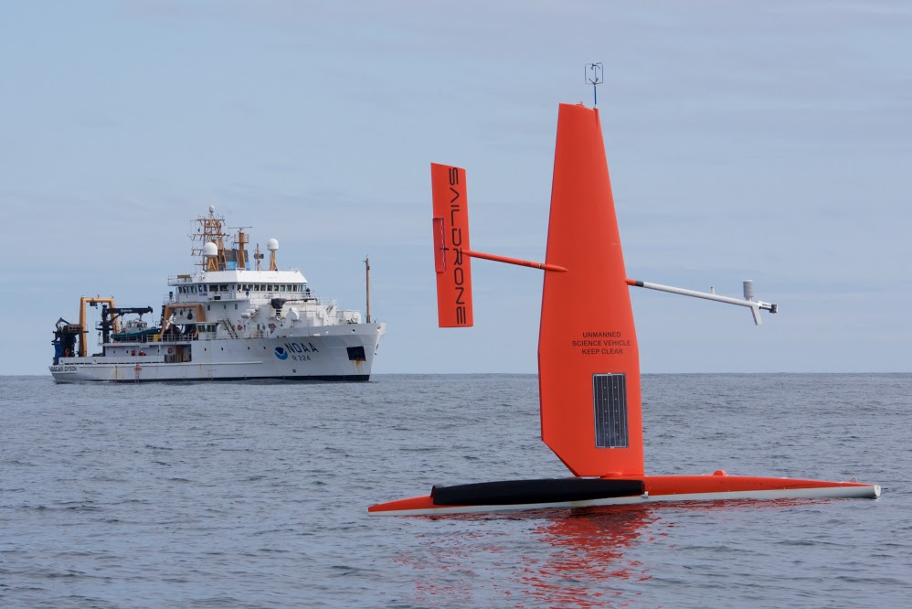 A Saildrone, seen with the NOAA Ship Oscar Dyson, studies ocean conditions.