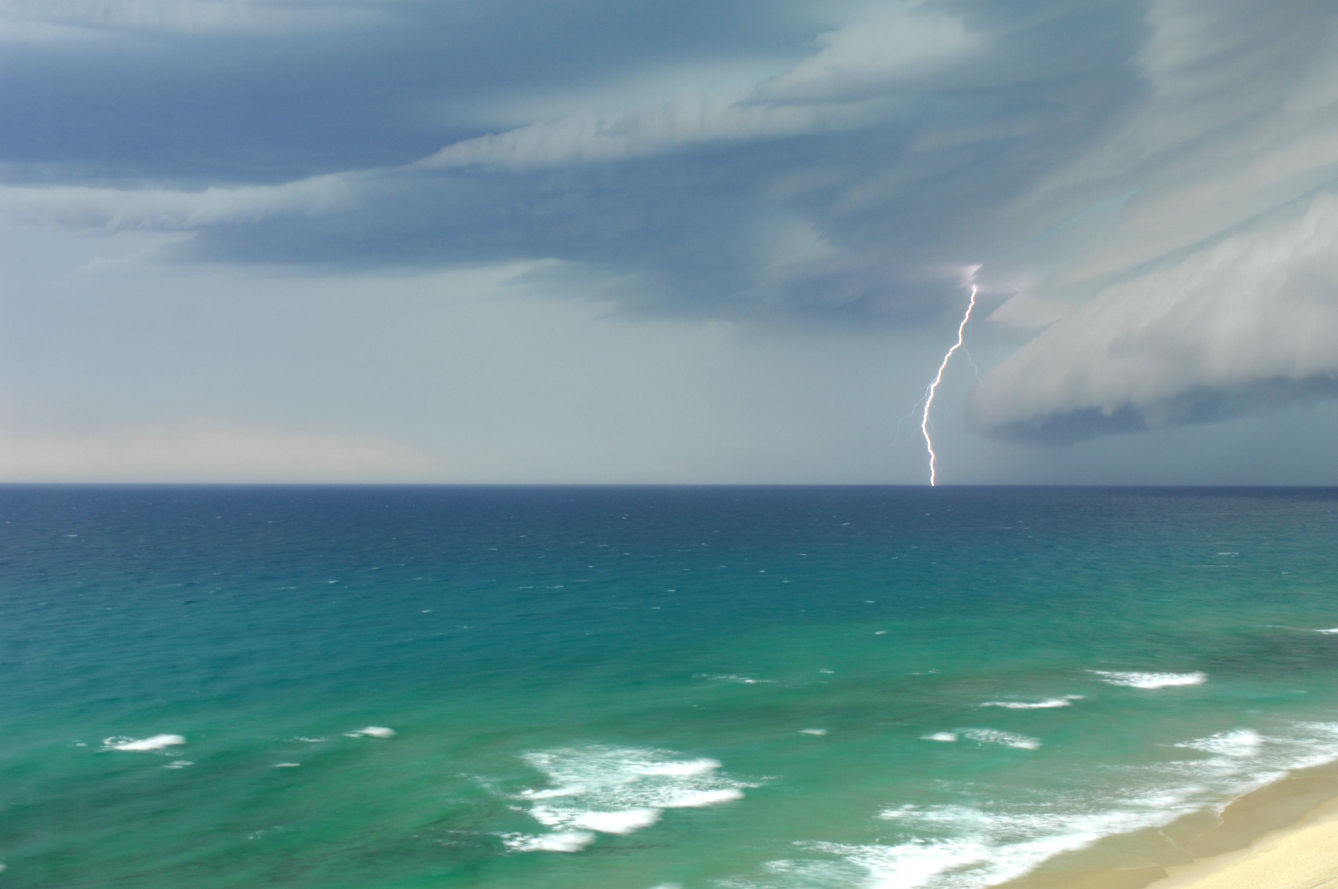 Lightning near a beach.