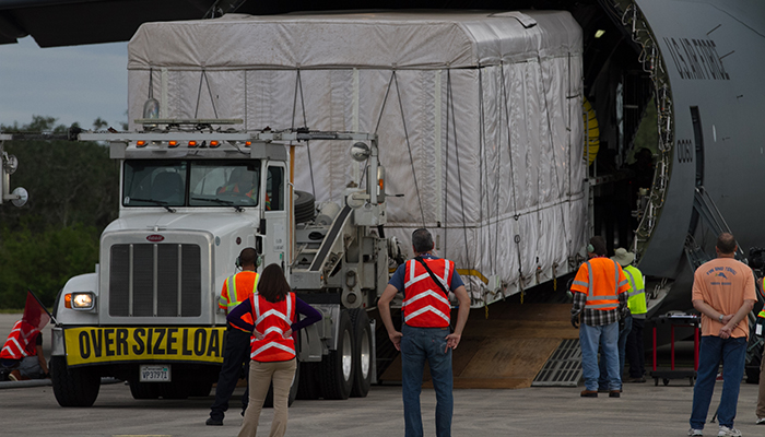 Wheels down: After arriving at Kennedy Space Center’s Shuttle Landing Facility in Florida, technicians slowly bring GOES-S off the plane for a short drive to Astrotech Space Operations in Titusville. 