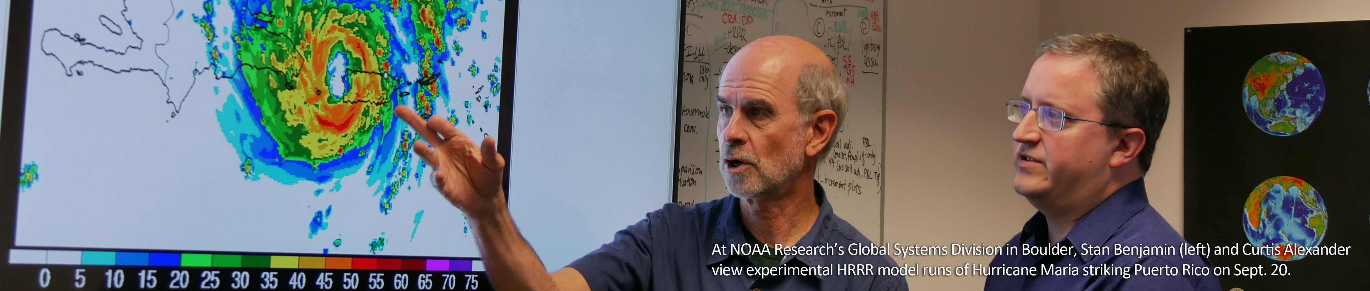 At NOAA Research's Global Systems Division in Boulder, Stan Benjamin (left) and Curtis Alexander view experimental HRRR model runs of Hurricane Maria striking Puerto Rico on Sept. 20.