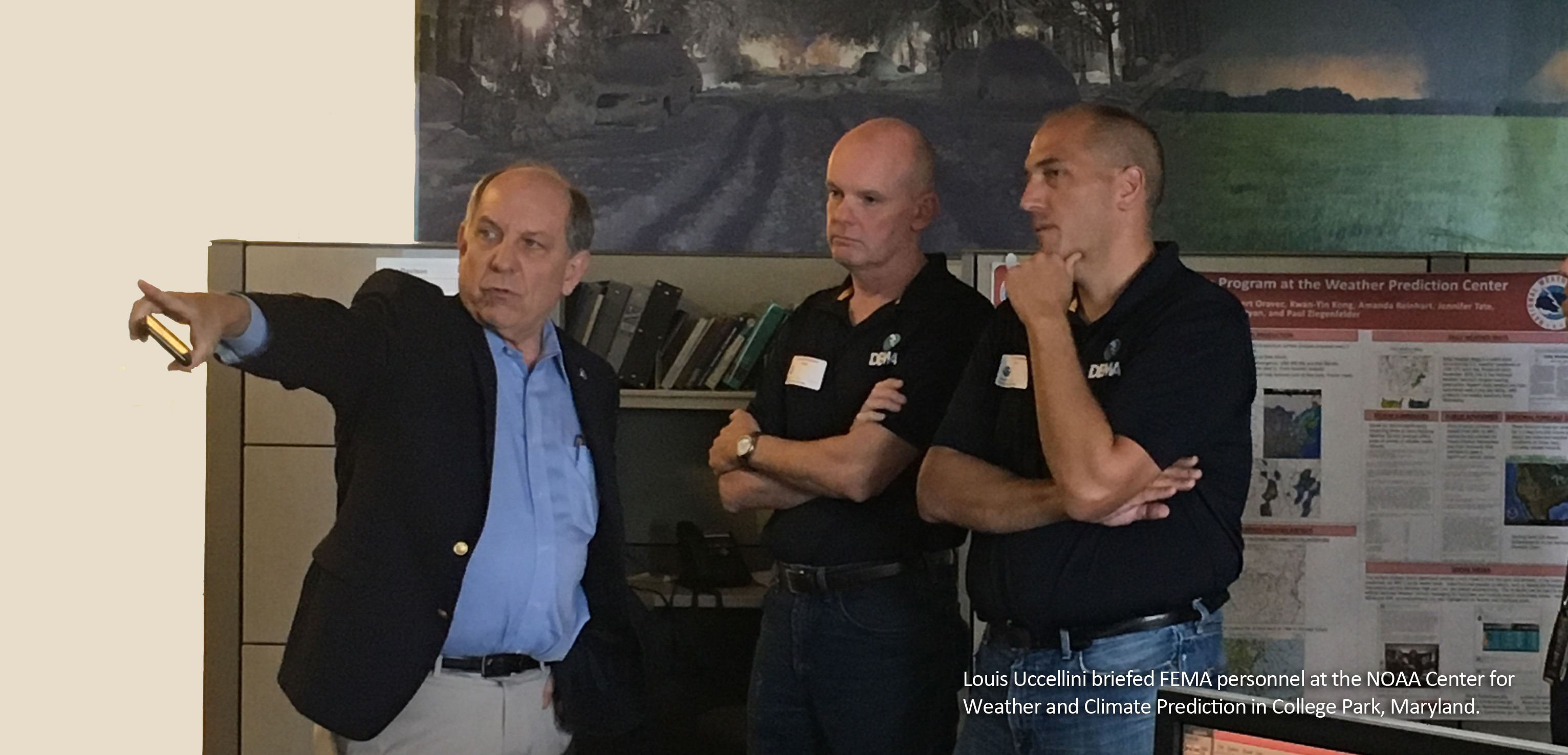 Louis Uccellini briefing FEMA personnel at the NOAA Center for Weather and Climate Prediction in College Park, Maryland.