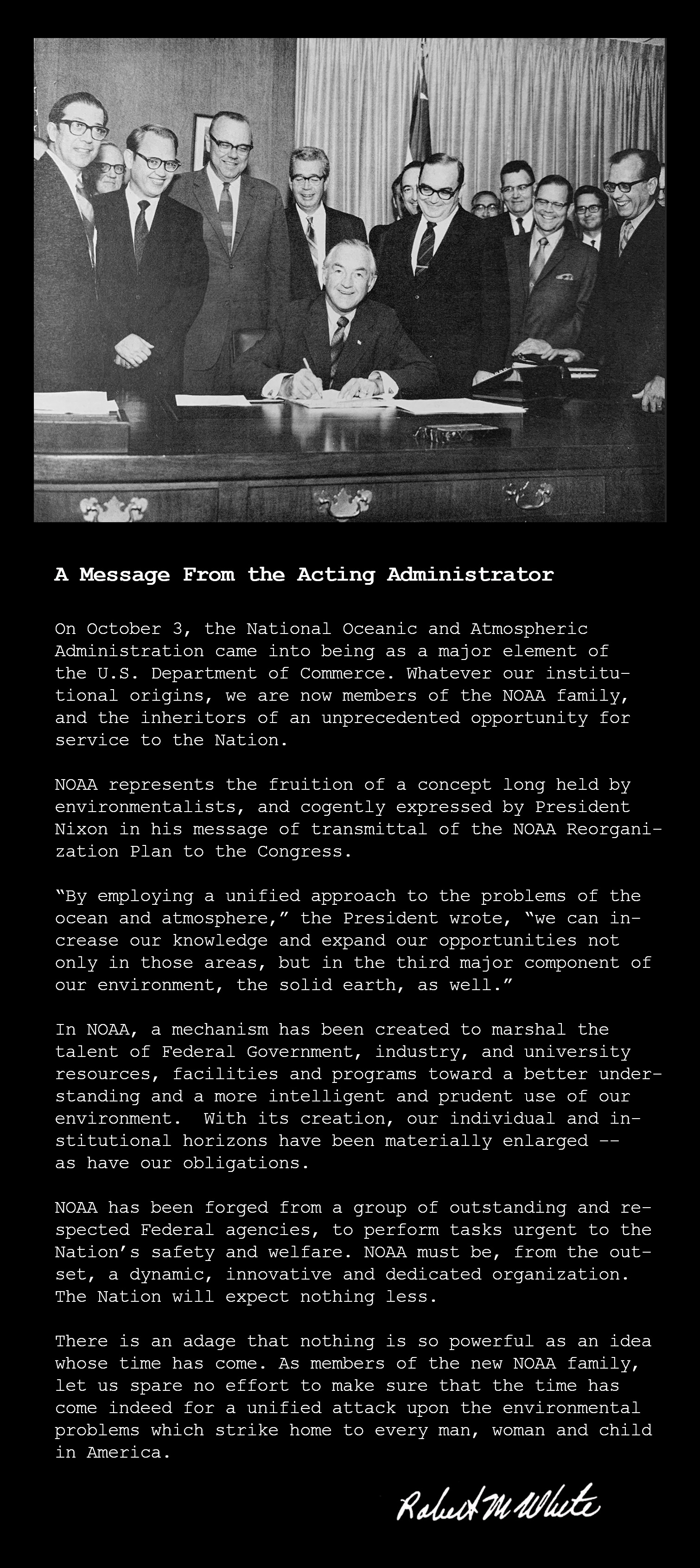 Secretary of Commerce Maurice H. Stans signs the department orders needed to put NOAA in operation on October 3, 1970. Dr. White is standing over Sec. Stans’ left shoulder.