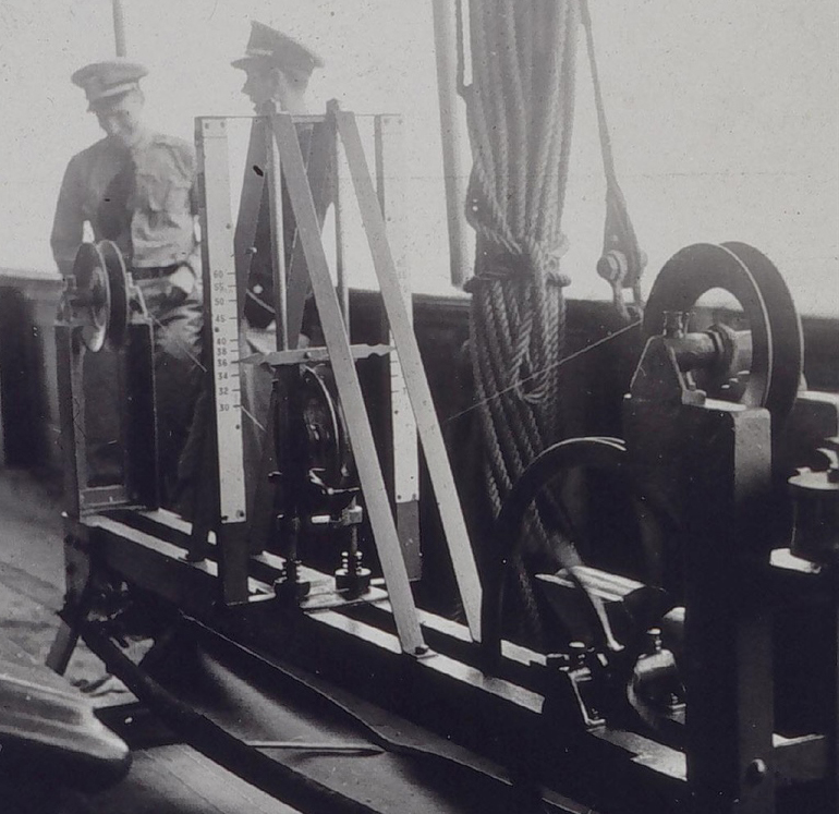 In 1939, officers at U.S. Coast and Geodetic Survey, a NOAA legacy agency, used this taut wire machine to measure the distance between floating hydrographic survey markers. If measured from shore, the wire was attached to an anchor. If measured offshore, it was attached to a buoy. NOAA Corps officers now use GPS and aerial image analyses to accurately measure distances and characterize features on nautical charts.