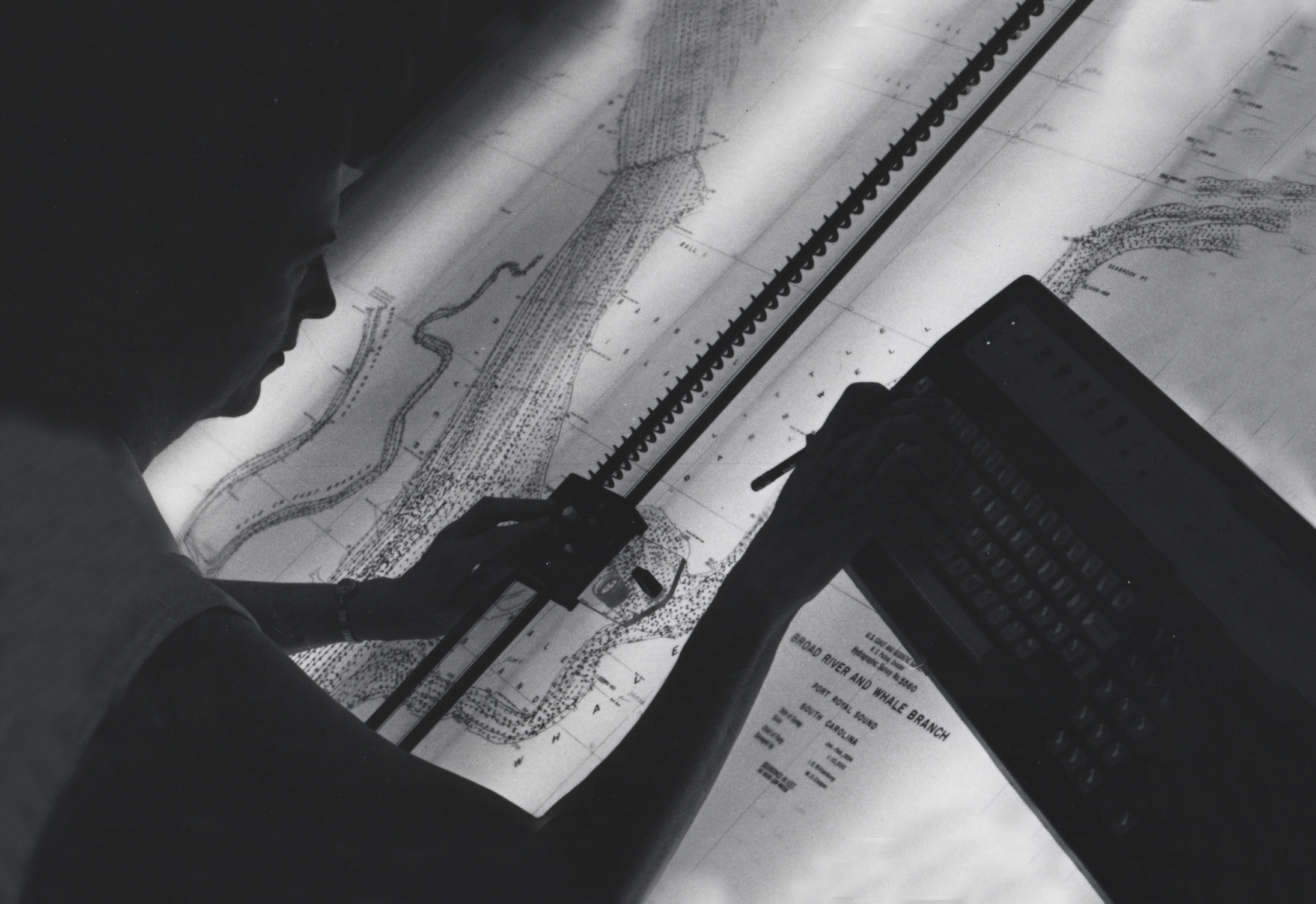 NOAA and its predecessor agencies have been collecting hydrographic data for nearly 200 years, always with a focus on time, position and depth. This photo, from the 1960s, shows the South Carolina shoreline being charted on paper on a light table.

A plotter, or button on a wired pad, traced distances and contours of various shapes such as islands and sandbars. Digitized information was then stored electronically, in contrast with today’s use of bathymetry data collected by sonar, in the air by LIDAR,