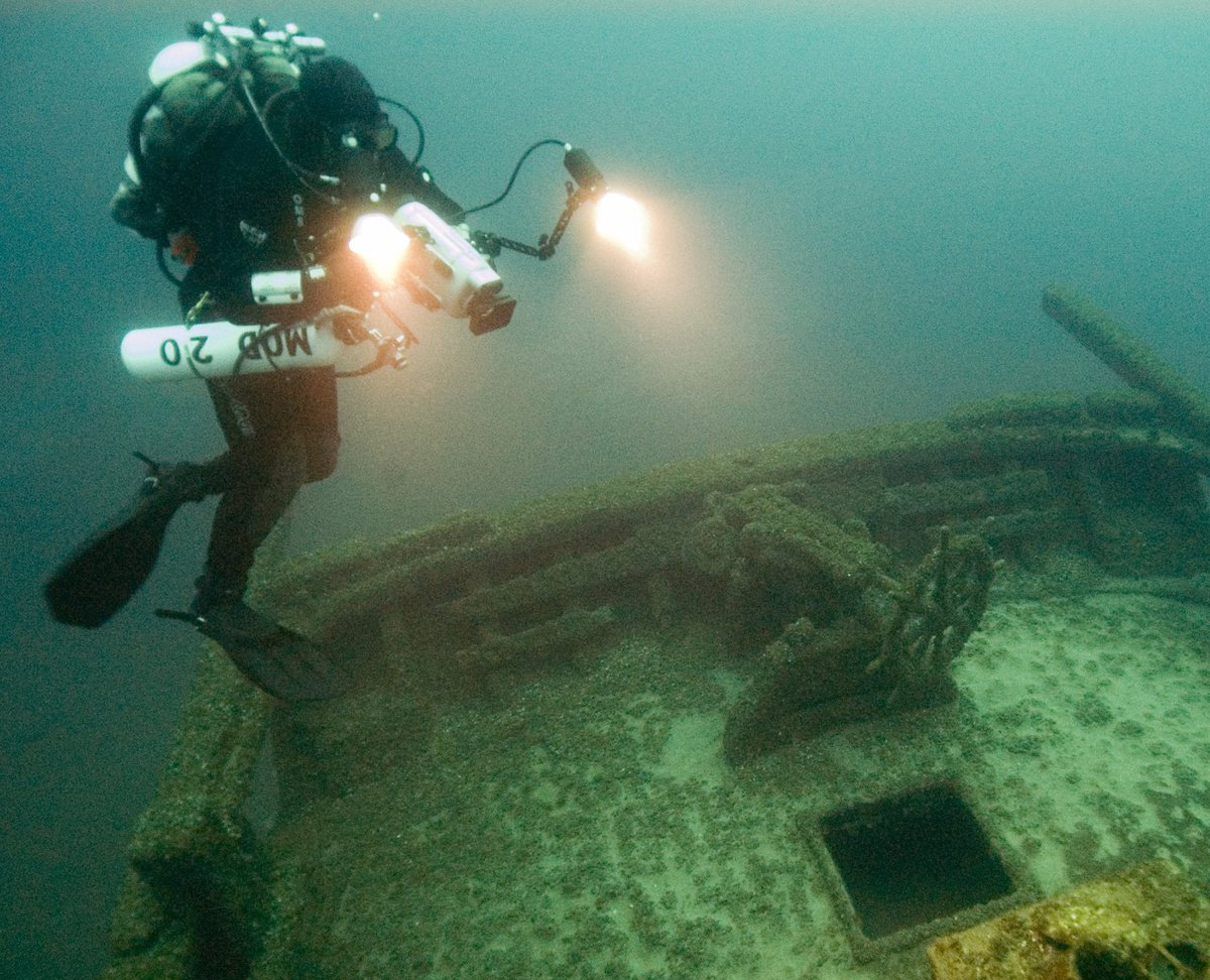The F.T. Barney schooner, sunk in 1868, lies 160 feet deep in Thunder Bay National Marine Sanctuary waters. With masts and deck gear intact, it's among the most complete wrecks of its kind.