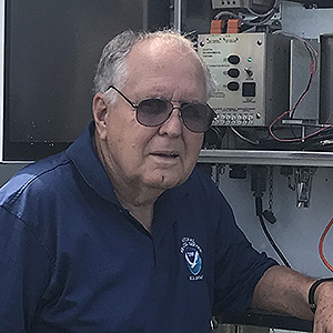 A photo of Stephen Butler, in a dark blue NOAA polo shirt, looking at camera.