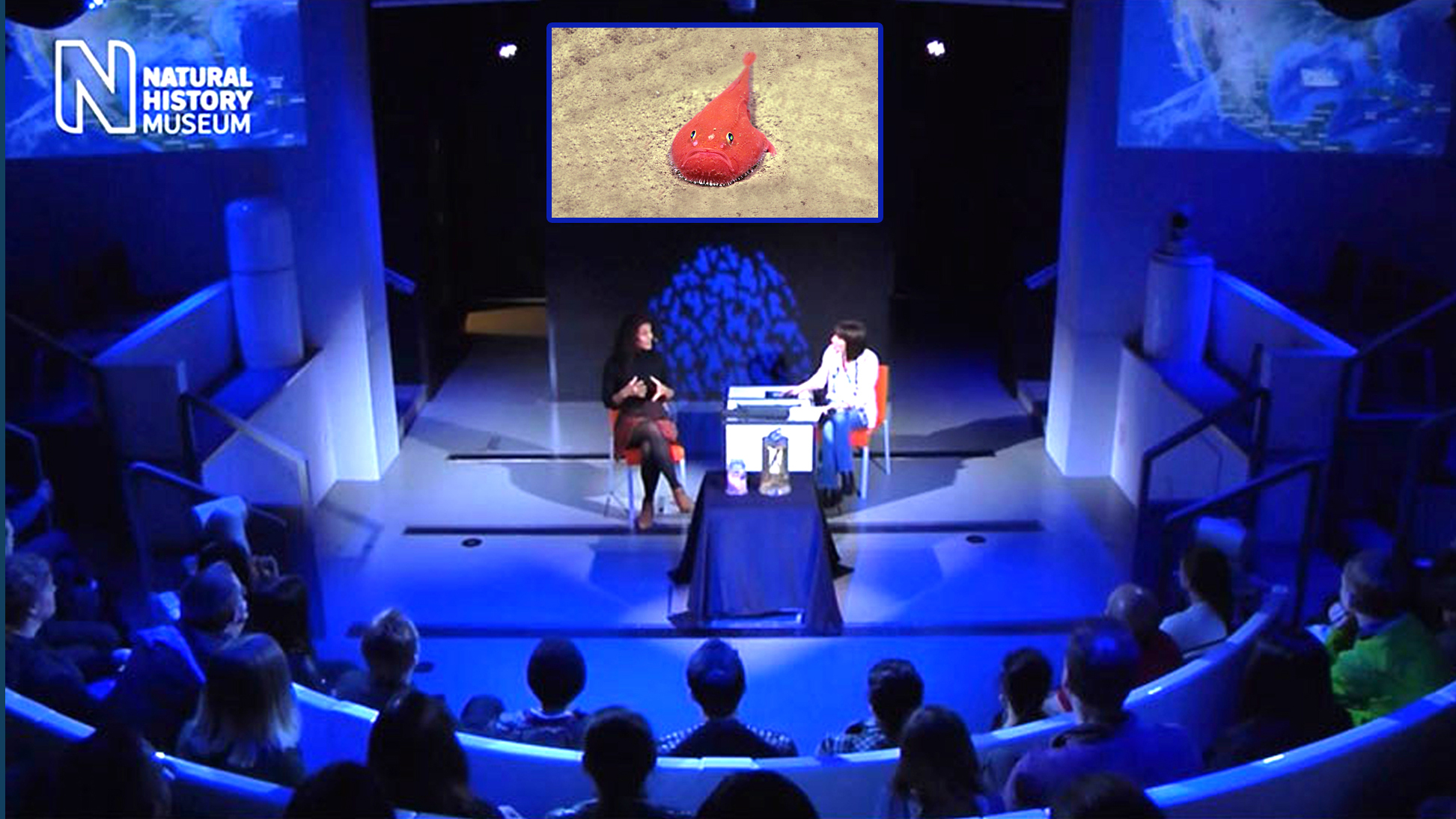 Image showing telepresence session beaming real-time information from aboard the NOAA Ship Okeanos Explorer to  an audience at  the Attenborough Studio in London’s Natural History Museum on April 27, 2018.