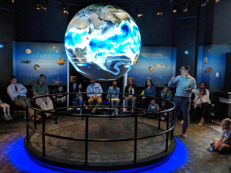 Meteorologist/Climatologist Tom DiLiberto presents on NOAA Science On a Sphere during NOAA Kids Day 2019.