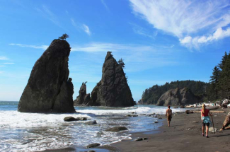 Visitors enjoy the scenery at Rialto Beach along the Olympic Coast National Marine Sanctuary.