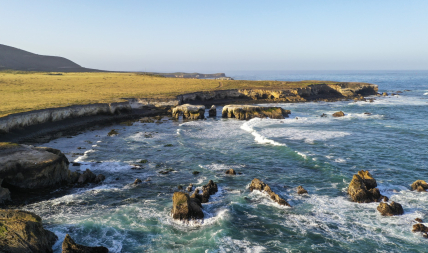 Sunny view of the rocky coastline and deep blue water of the area proposed for the Chumash Heritage National Marine Sanctuary in San Luis Obispo County, California.
