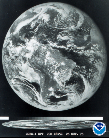 The first image of Earth from NOAA's Geostationary Operational Environmental Satellite (GOES) series of satellites, taken by GOES-1 on October 25, 1975 nine days after its launch. A view of Earth is shown in black and white.
