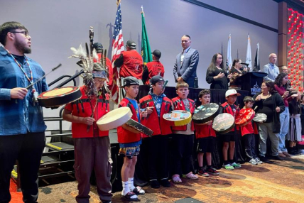 Tulalip tribal youth singers and dancers kicked off the celebration of new federal funding for tribal fish hatcheries.
