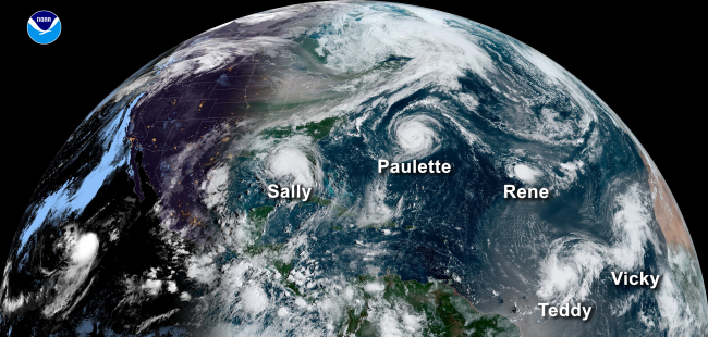 A satellite image of the Atlantic Ocean.. Five hurricanes are pictured, stretching from the west coast of Africa to the Gulf of Mexico, from the northern waters of Brazil to the mid-Atlantic. 