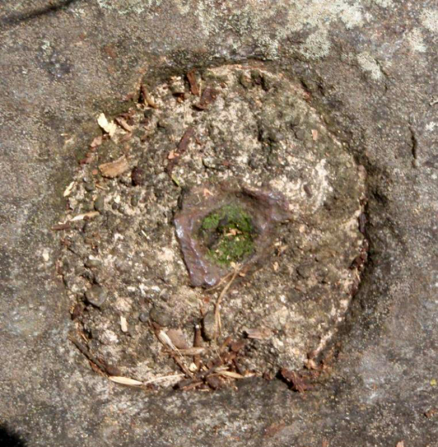 Close-up photo of the mark placed by Hassler in 1833, which was an iron pipe inserted into bedrock. The marker was recovered in the twentieth century and marked with a commemorative plaque as part of the celebration of the nation’s bicentennial in 1976.
