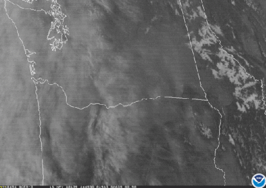 Eruption of Mount St. Helens, seen via GOES-3: visible band 1. The imagery wis in black and white with a overlay of the sate of lines of Washington and part of California.