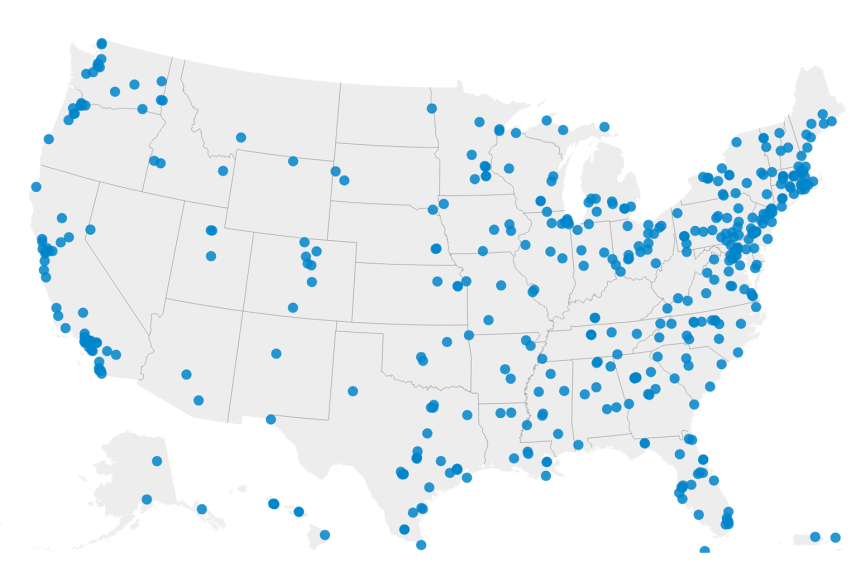 A map with data points indicating scholar institutions. Though there are data points across the map, they are densest along the coast. There are fewer data points in the Great Plains region.