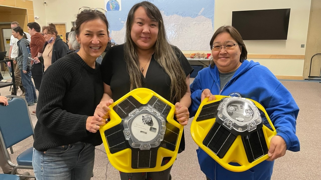 Alaska Eskimo Whaling Commission staff hold Sofar buoys at co-production workshop.