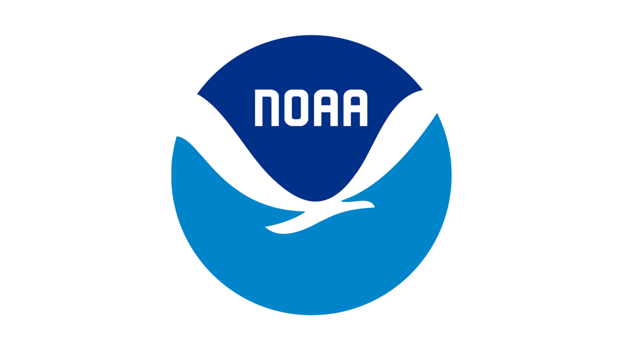 NOAA Logo, featuring a white bird separating two fields of blue, darker on top, lighter on bottom. The word NOAA, sits in the darker blue field above the bird.
