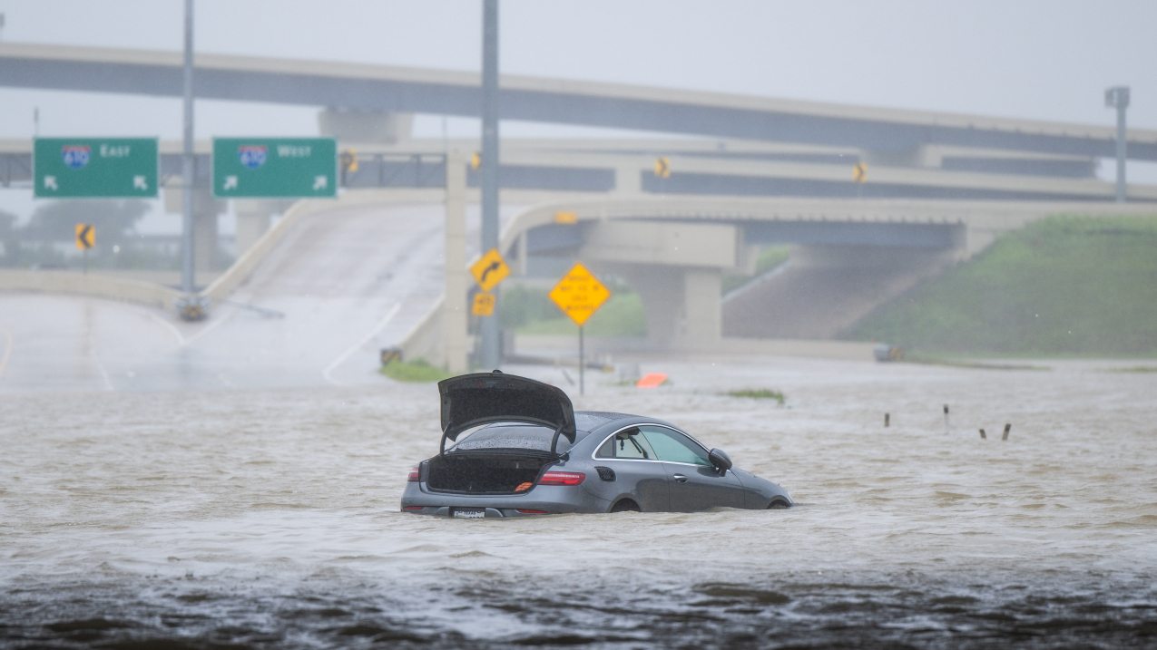 HOUSTON, TEXAS - JULY 8, 2024: A vehicle is left abandoned in floodwater on a highway after Hurricane Beryl swept through the area. Credit: Getty Images.