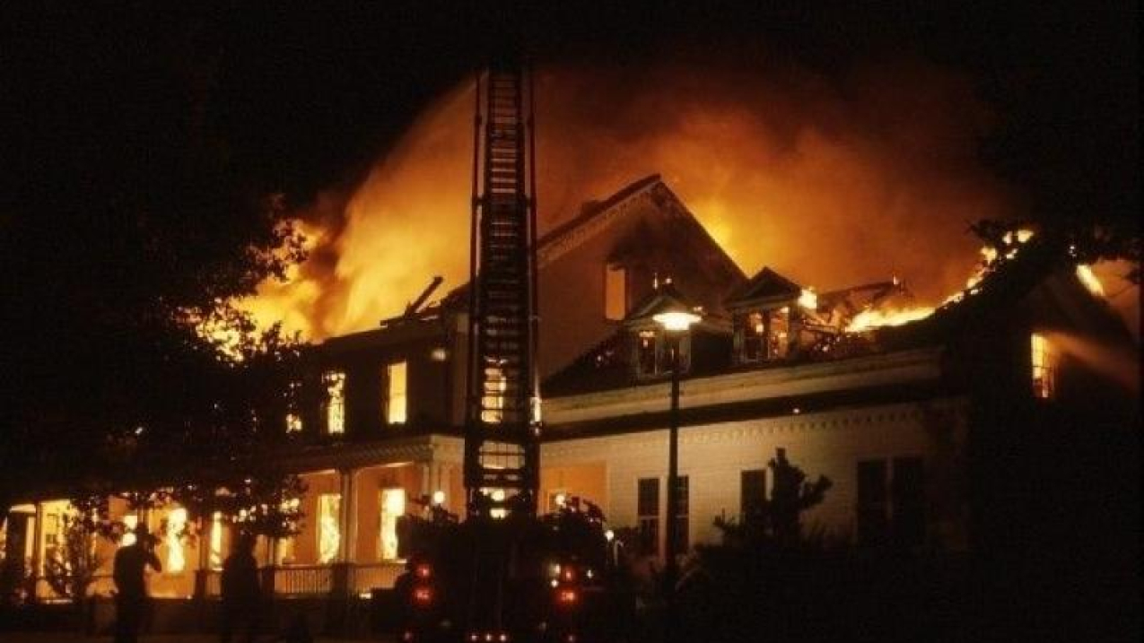 Sandy Hook Lab on fire, ladder truck in front of burning building.