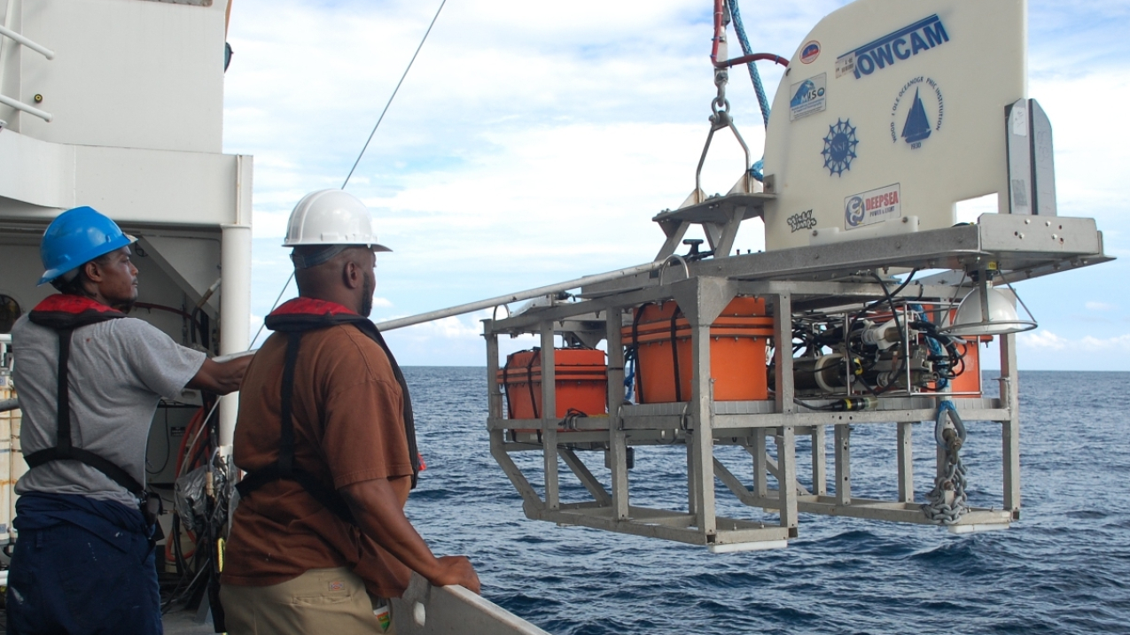Image showing two people deploying a towed camera system from a research vessel at sea. Our oceans, coasts, and Great Lakes play a crucial role in our weather, our economy, and our everyday lives across the nation. The development of instruments and sensors that give us information about our coasts and waters are indispensable to a healthy economy, and represent a growing field for development and innovation. Credit NOAA