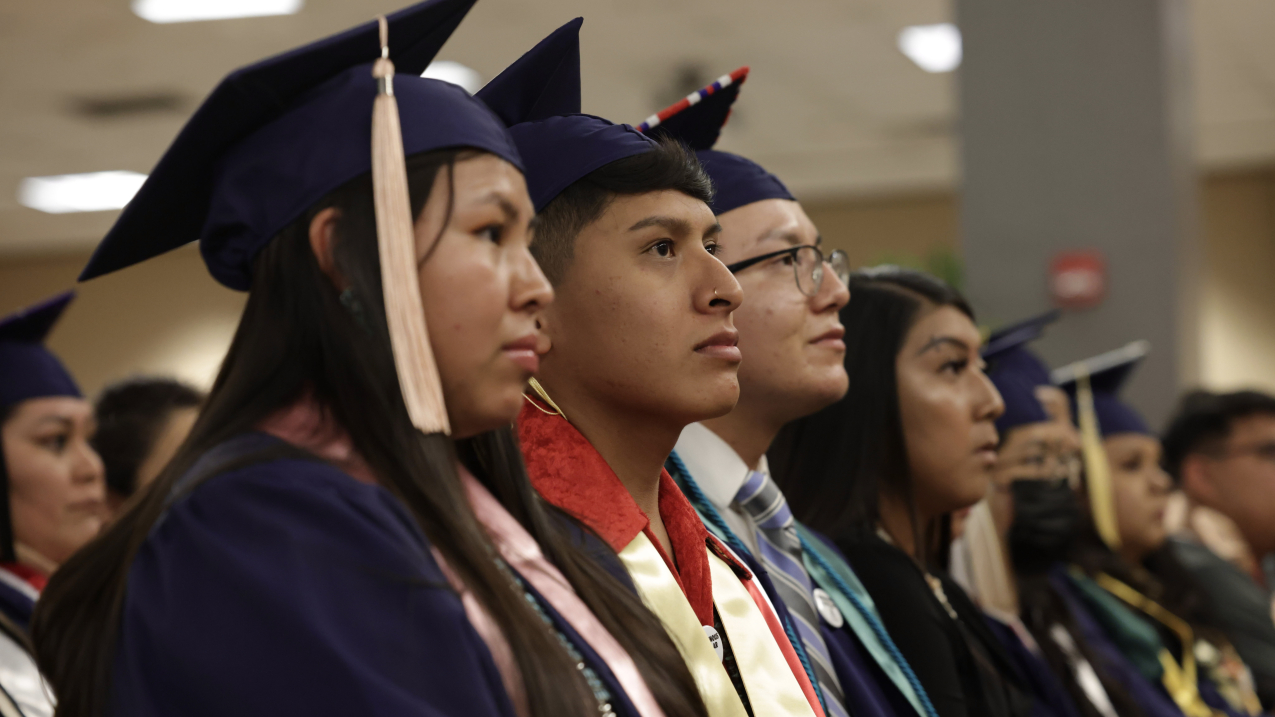 Pnoto showing graduates listen to speakers at the University of Arizona’s 2022 convocation ceremony for Native American Student Affairs. Credit: Chris Richards/University of Arizona.