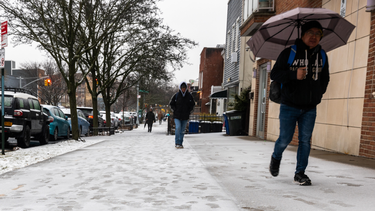 FEBRUARY 6, 2025: People walk through light morning snow in Brooklyn, New York. Despite Arctic air outbreaks and snow in January and February, the U.S. had a relatively warm and dry meteorological winter.