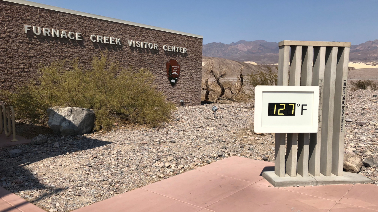 Death Valley National Park set a new world record in July 2018: It was the hottest place during hottest month on record. Temperatures reached 127 degrees F for four days in a row (as shown in this photo of a temperature sign in front of the park's visitor center), and the park experienced an average monthly temperature of 108 degrees for July. Learn more at https://www.nps.gov/deva. 