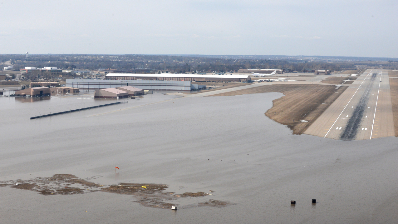 An aerial view of Offutt Air Force Base and the surrounding areas affected by flood waters March 17, 2019. An increase in water levels of surrounding rivers and waterways caused by record-setting snowfall over the winter in addition to a large drop in air pressure caused widespread flooding across the state of Nebraska. See more Air Force photos at https://www.afspc.af.mil.
