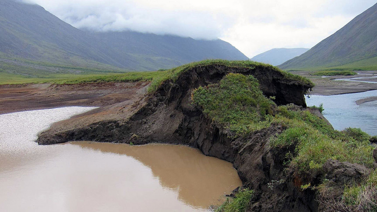 Permafrost is thawing across the Arctic, causing northern lands to sink or change shape. In Gates of the Arctic National Park, a bank of this lake thawed, allowing the Okokmilaga River to cut through and drain it to sea. Scientists are particularly concerned about what will happen as the frozen ground releases carbon dioxide and methane that were formerly stored under the surface. 