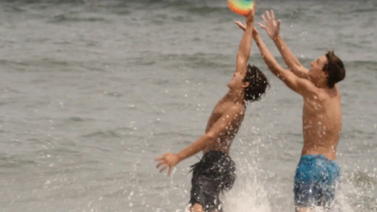 Play it safe story map opening. Two boys playing at the beach.