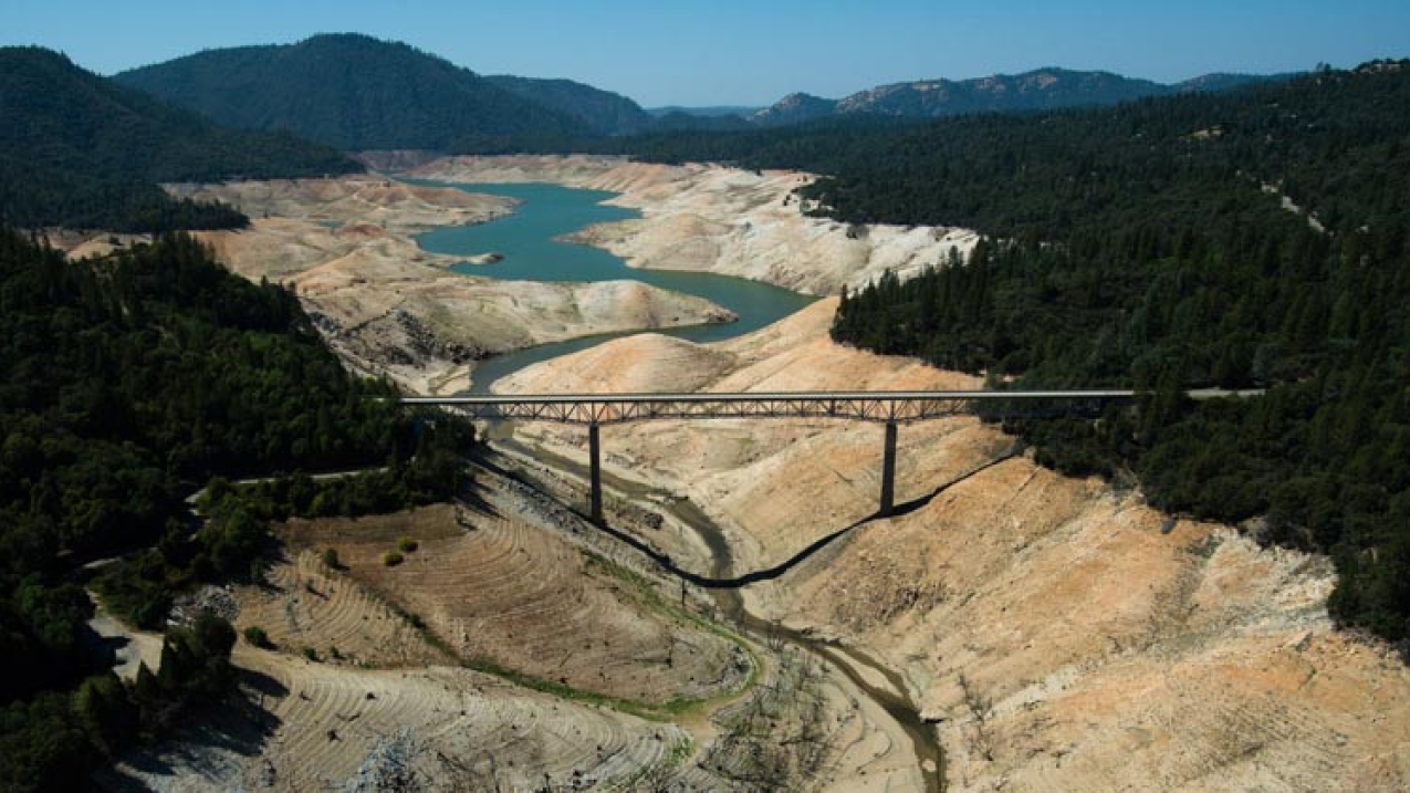 The Enterprise Bridge passes over a section of Lake Oroville that was nearly dry on September 30, 2014, in Oroville, California. Lake Oroville, California's 2nd largest reservoir, was at 49% of average (30% of capacity), the second lowest level on record (behind 1977.) Heavy rains in December 2014 allowed lake levels to recover slightly--as of January 23, 2015 Lake Oroville was at its 7th lowest level of the past 35 years.