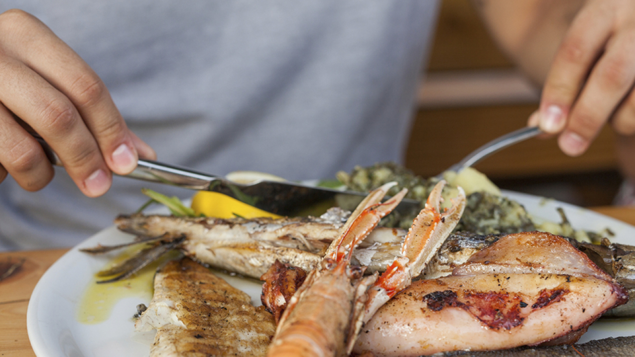 Enjoying a seafood dinner.