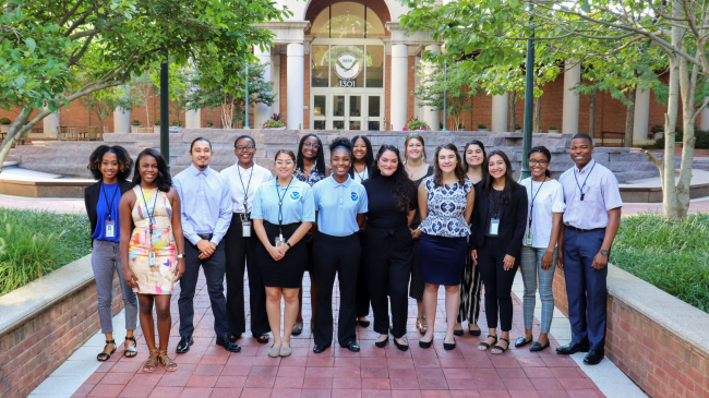 Students pose for a group photo outside NOAA headquarters.