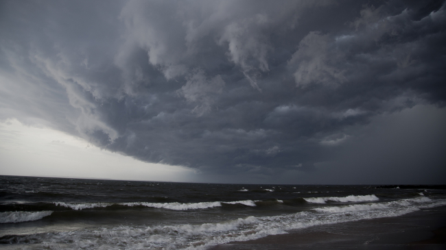 Storm clouds gather over Brighton Beach. 