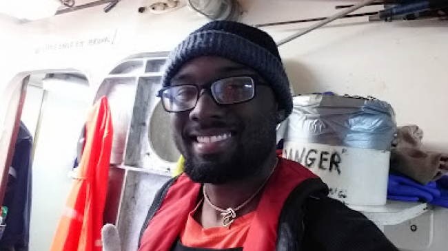 Fishery observer Keenan Carpenter on a fishing vessel. Photo courtesy of Keenan Carpenter.