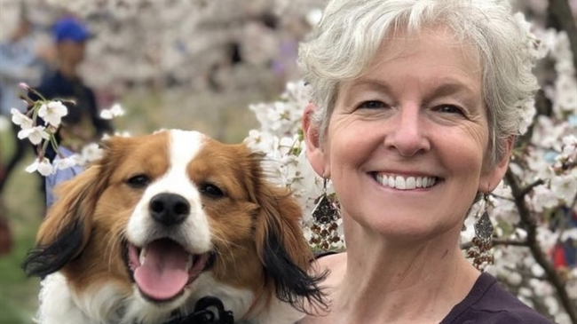 Ko Barrett, NOAA’s senior climate advisor, poses for a photo with her dog.