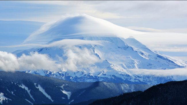 Snowy mountain with clouds