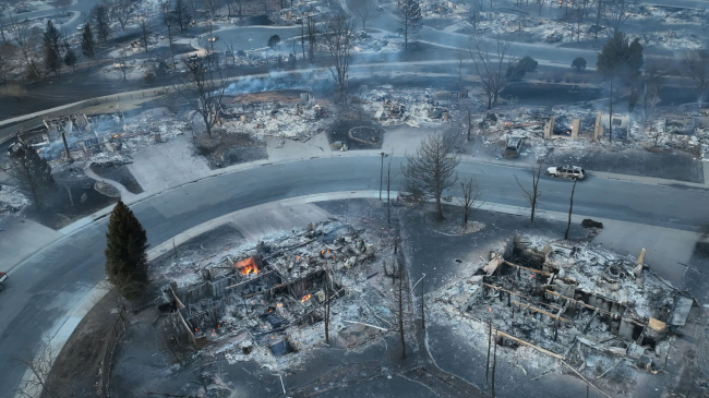 Aerial view of smoldering ruins in Colorado fire.