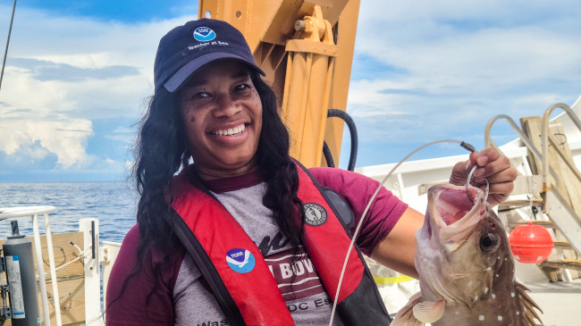 Teacher at Sea Maronda Hastie holds a snowy grouper.