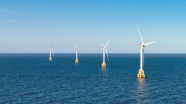 Photo of a wind turbines generate electricity at the Block Island Wind Farm on July 07, 2022 near Block Island, Rhode Island. 