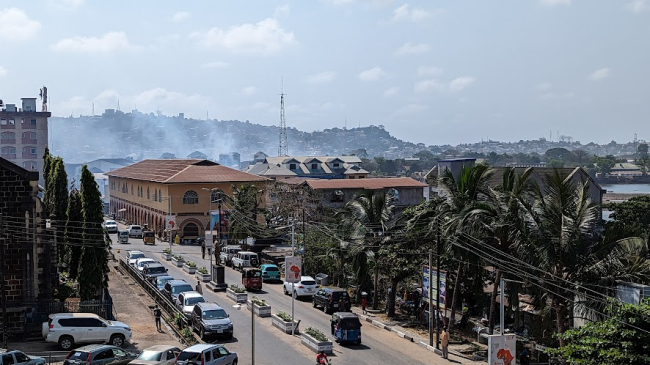 An aerial view of bright sun over the city of Freetown, Sierra Leone.