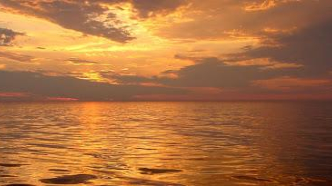 Sunset at sea. Atlantic, United States Northeast. 2005 August 14. Courtesy of the Personnel of the NOAA Ship DELAWARE II.