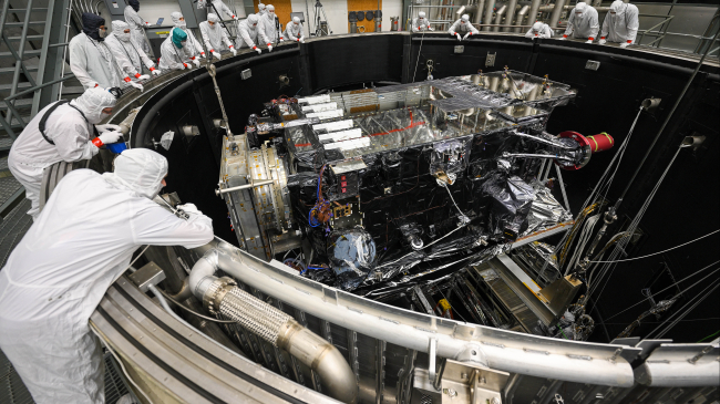 GOES-U is lowered into the thermal vacuum chamber.